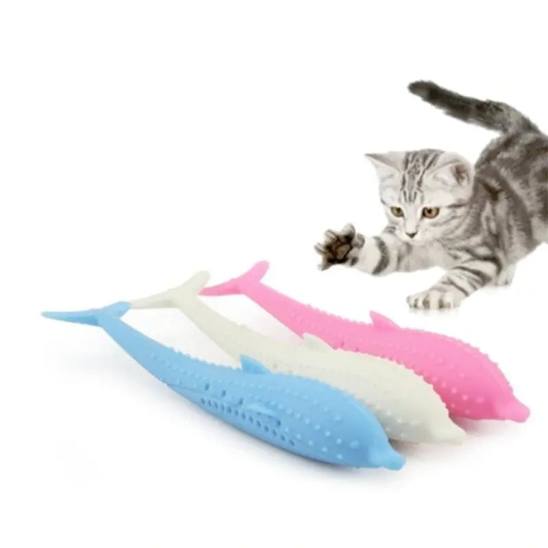 Brosse à dents en silicone en forme de dauphin pour chat sur fond blanc